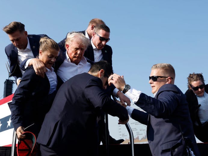 Donald Trump is shielded by Secret Service agents after an assassination attempt in Pennsylvania in July, 2024.Anna Moneymaker via Getty Images