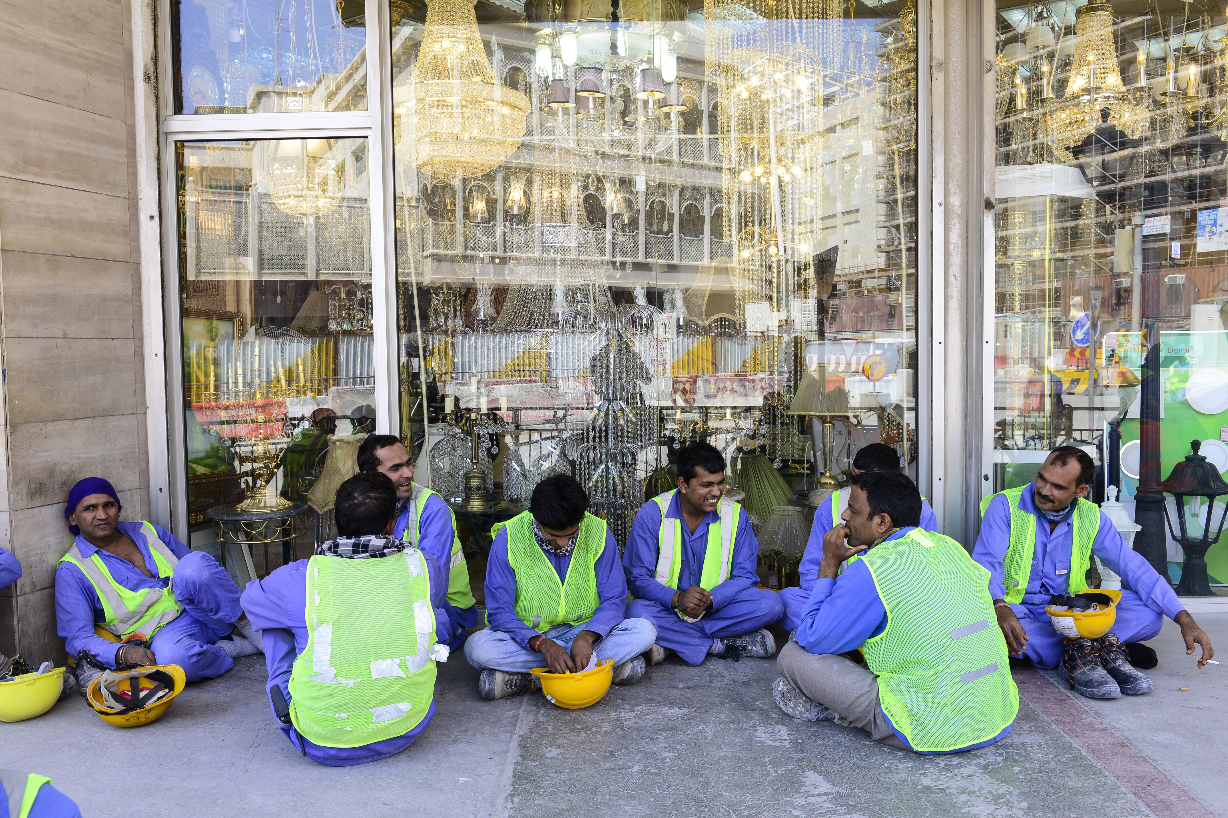 Migrant workers from all over the world waiting for their lunch at one of the construction sites for the FIFA World Cup in Qatar