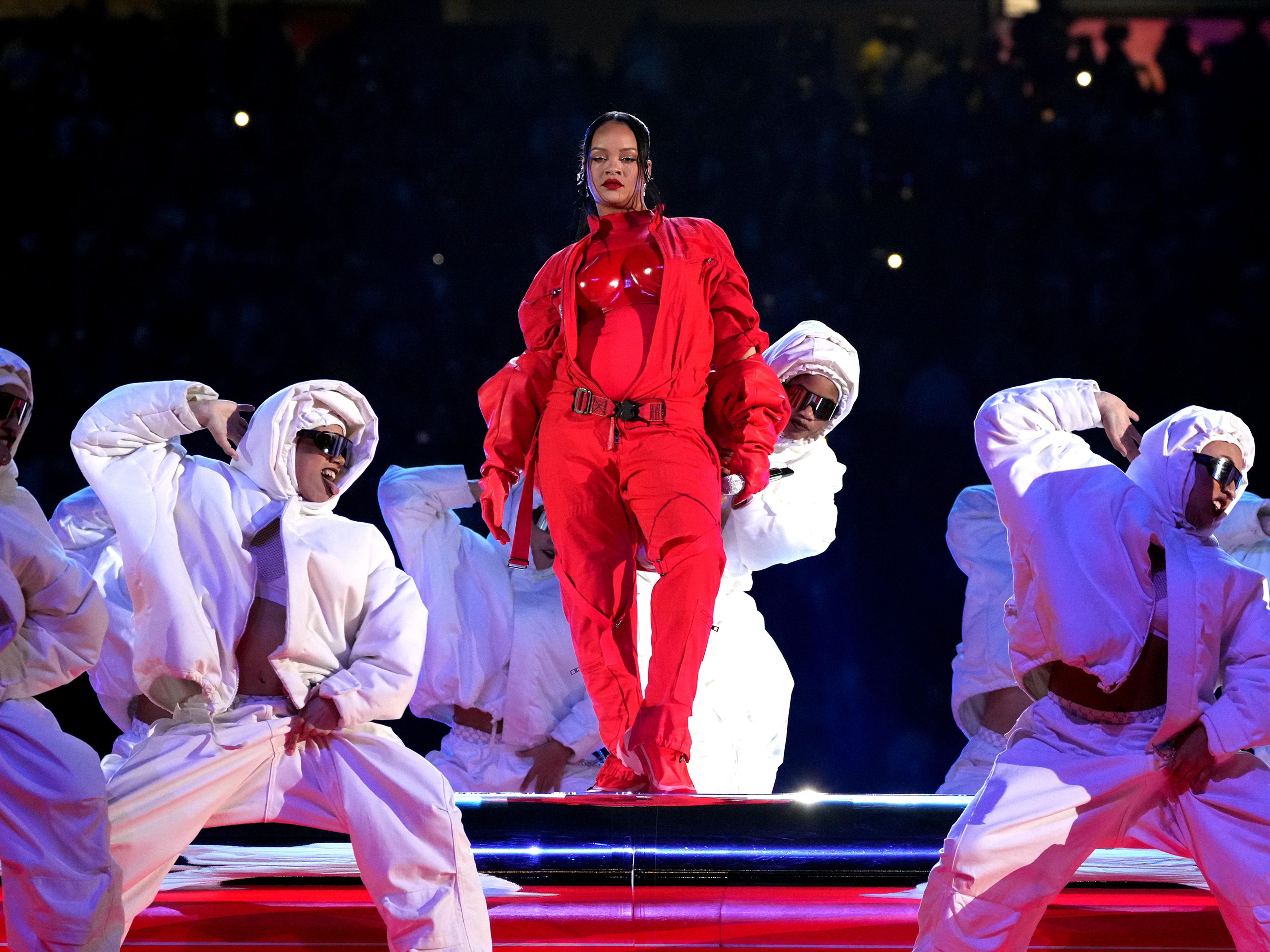 Rihanna revealed a baby bump while headlining the Super Bowl halftime show in February 2023.