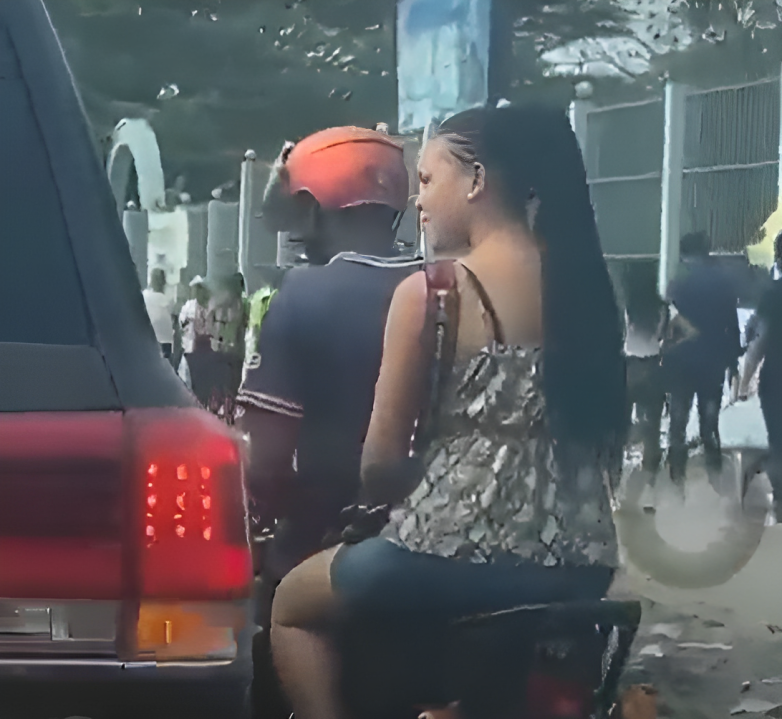 Lady conversing with Land Cruiser motorist