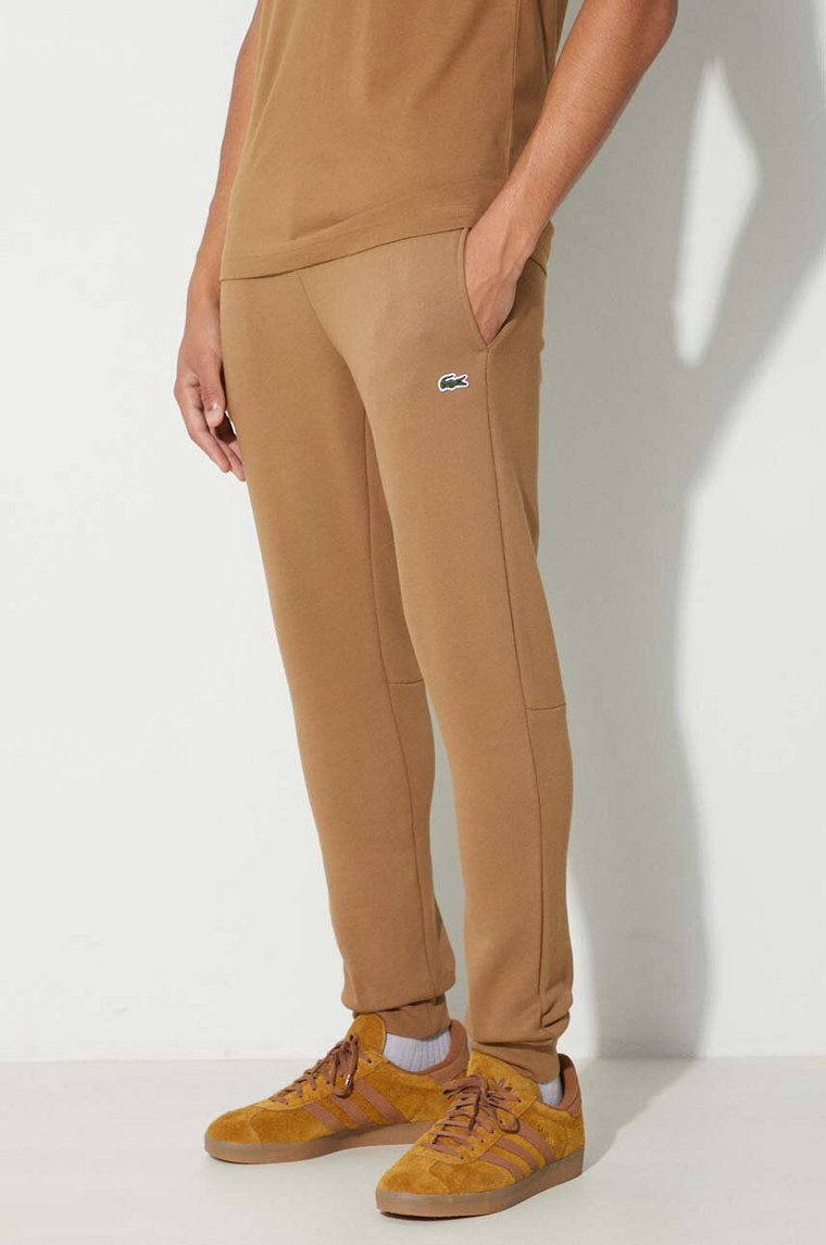 Lacoste spodnie dresowe męskie kolor brązowy gładkie