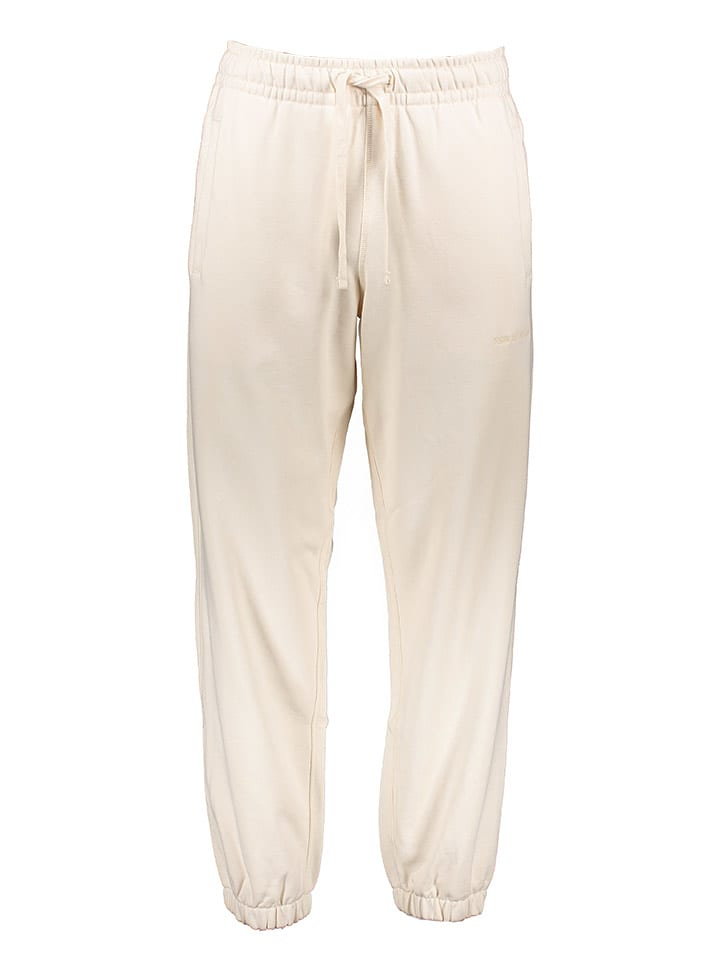 New Balance Spodnie dresowe w kolorze kremowym