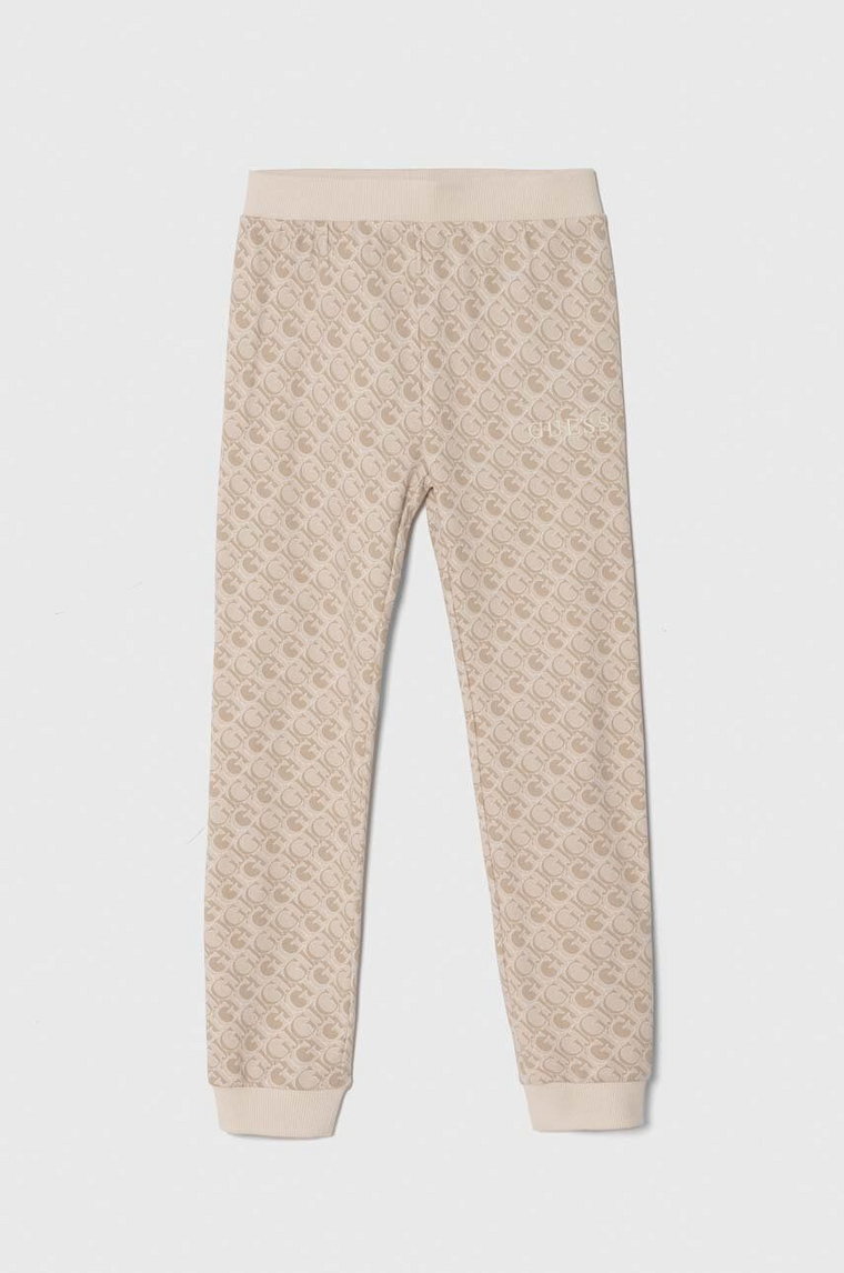 Guess spodnie dresowe bawełniane dziecięce kolor beżowy wzorzyste J4YQ11 KA6R4