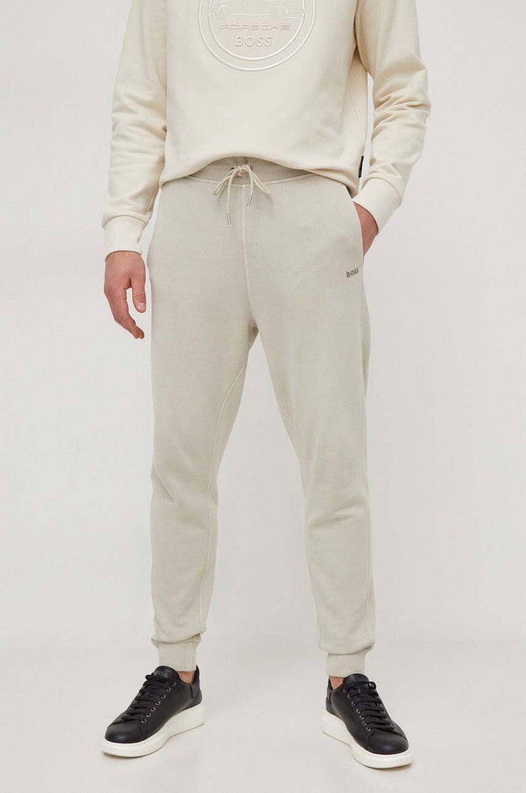 BOSS spodnie dresowe bawełniane BOSS CASUAL kolor beżowy gładkie 50472661