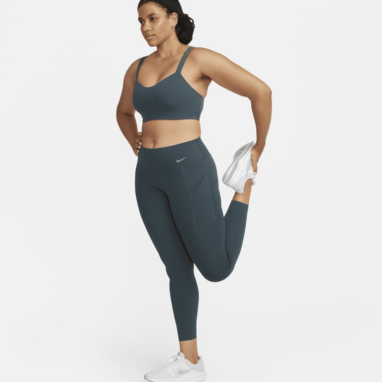Damskie legginsy ze średnim stanem i kieszeniami o długości 7/8 zapewniające średnie wsparcie Nike Universa - Zieleń