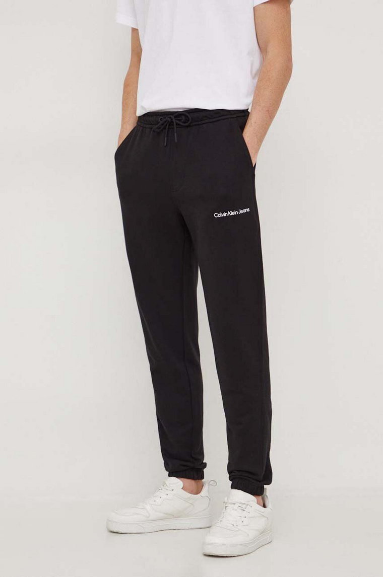 Calvin Klein Jeans spodnie dresowe bawełniane kolor czarny gładkie