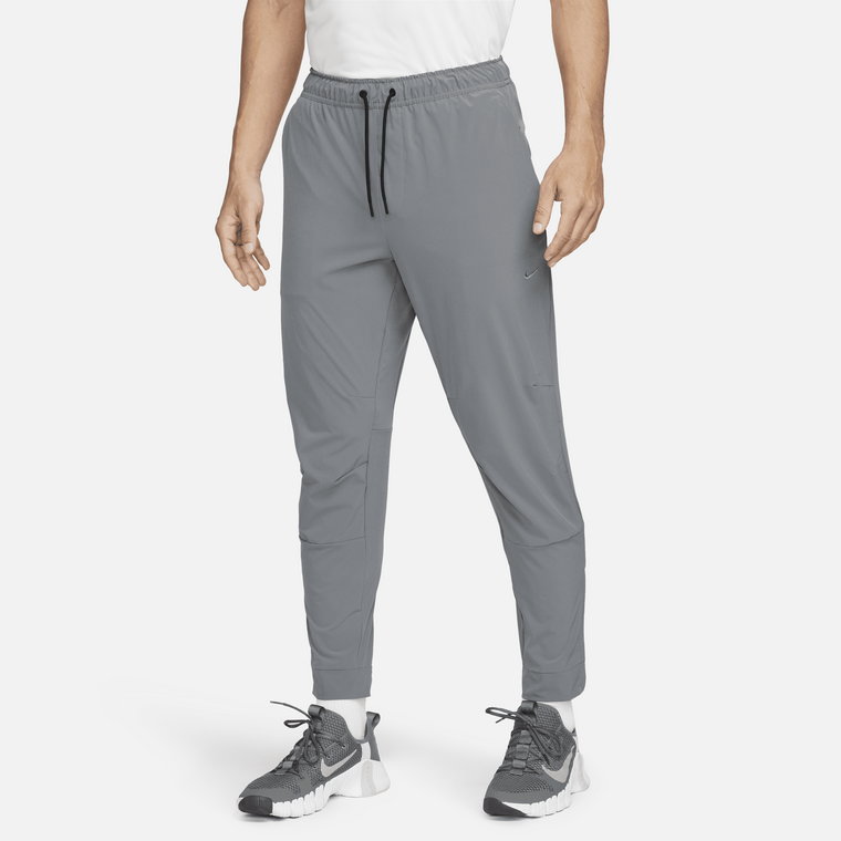 Męskie uniwersalne spodnie ze ściągaczami i zamkami Dri-FIT Nike Unlimited - Zieleń