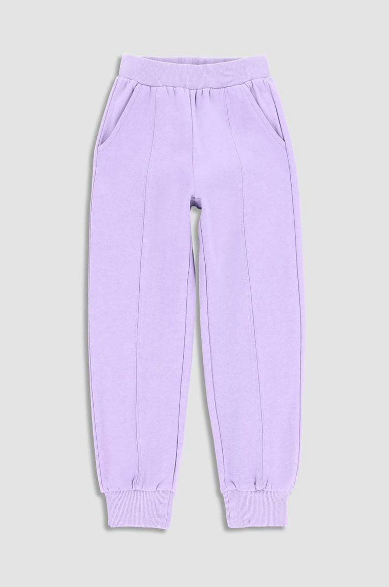 Coccodrillo spodnie dresowe bawełniane dziecięce kolor fioletowy gładkie