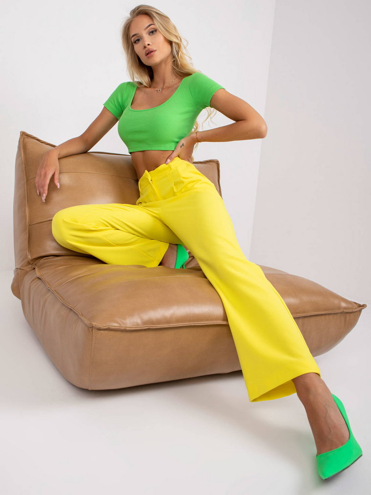 Spodnie z materiału żółty casual materiałowe nogawka szeroka suwak haftka