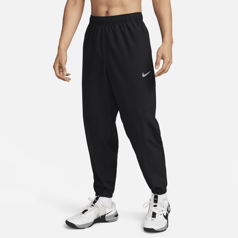 Męskie uniwersalne spodnie ze zwężanymi nogawkami Dri-FIT Nike Form - Czerń