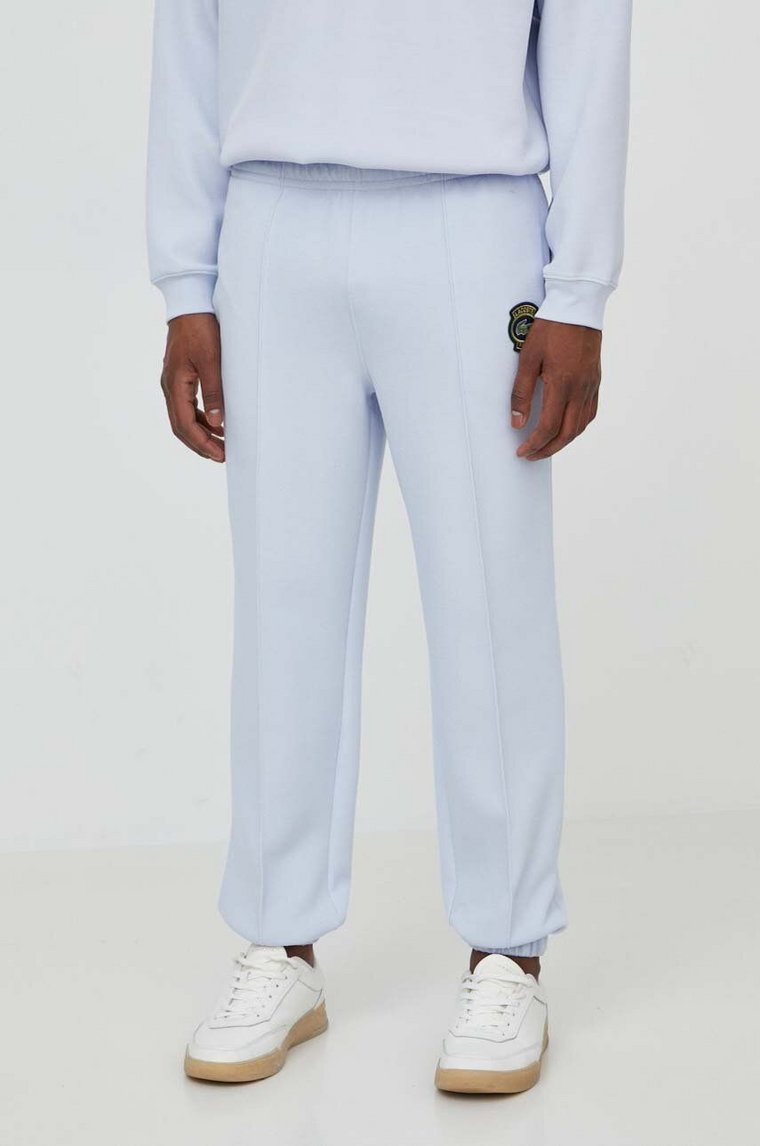 Lacoste spodnie dresowe kolor niebieski gładkie
