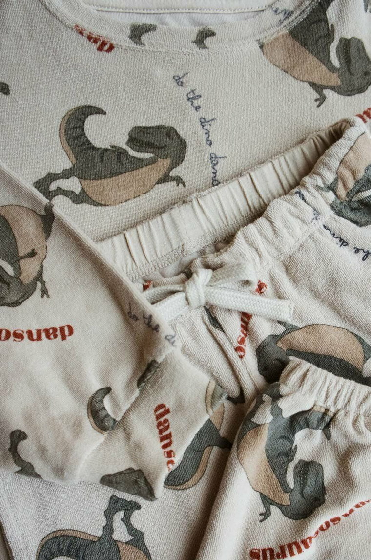 Konges Sløjd spodnie dresowe bawełniane dziecięce kolor beżowy wzorzyste