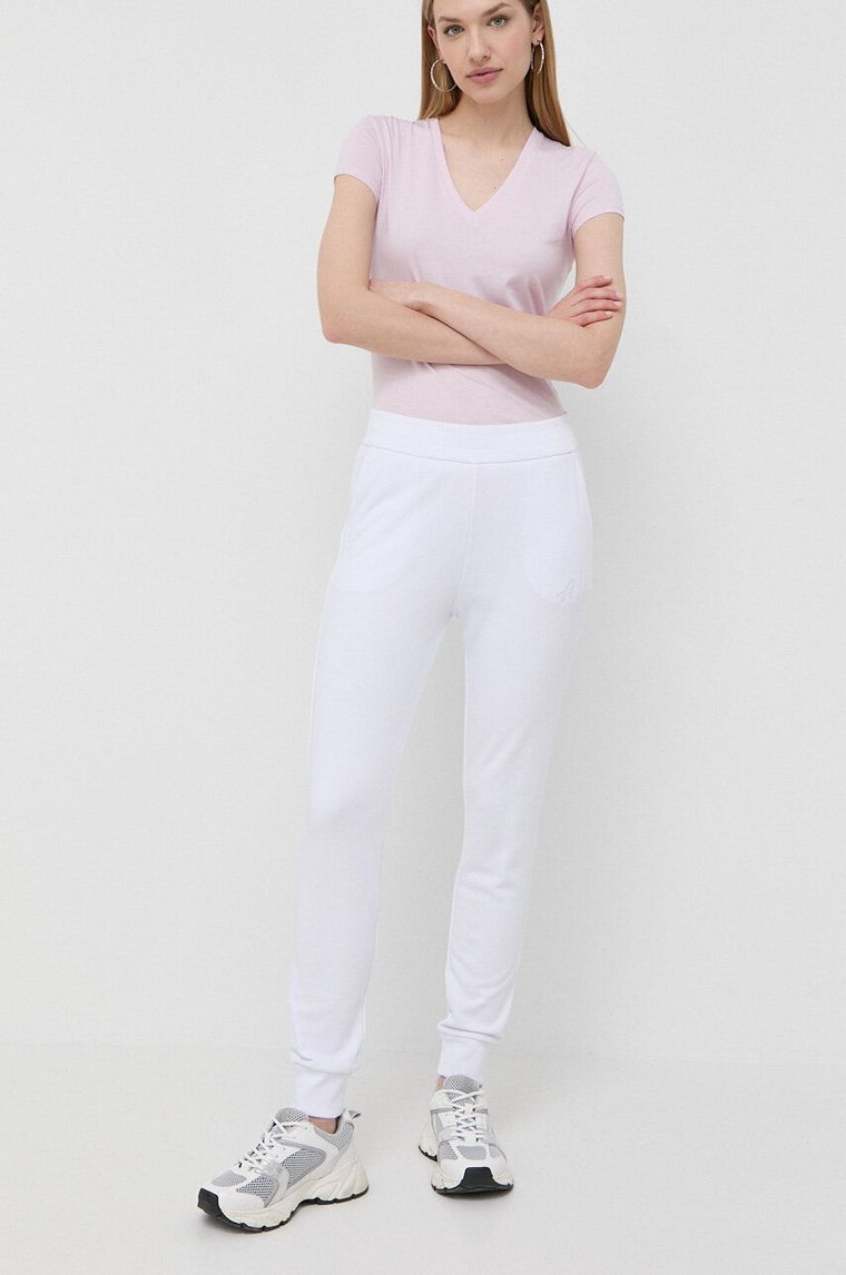 Armani Exchange spodnie dresowe kolor biały z aplikacją
