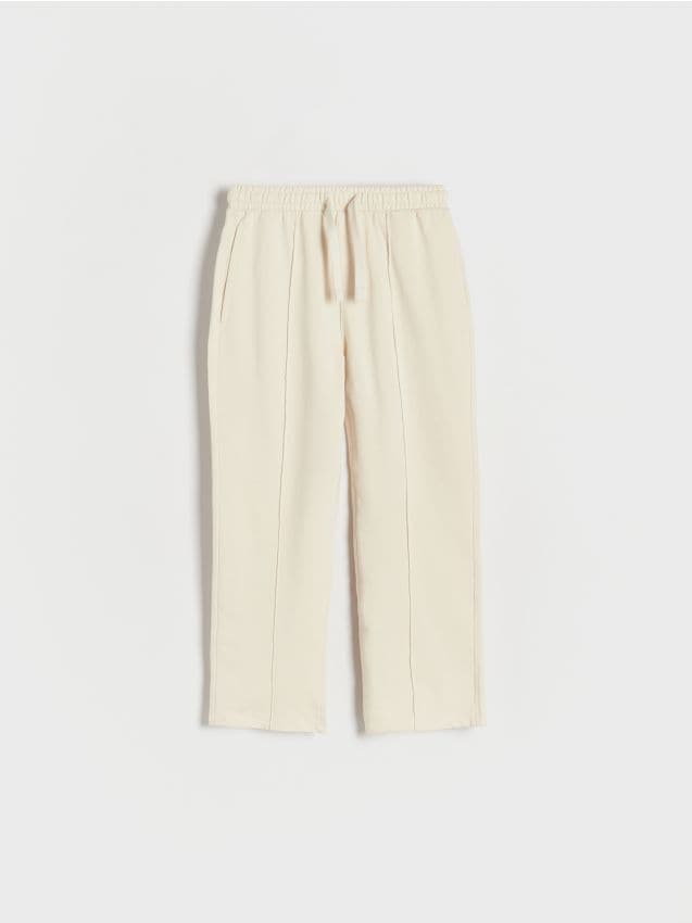 Reserved - Dresowe spodnie z przeszyciami - kremowy