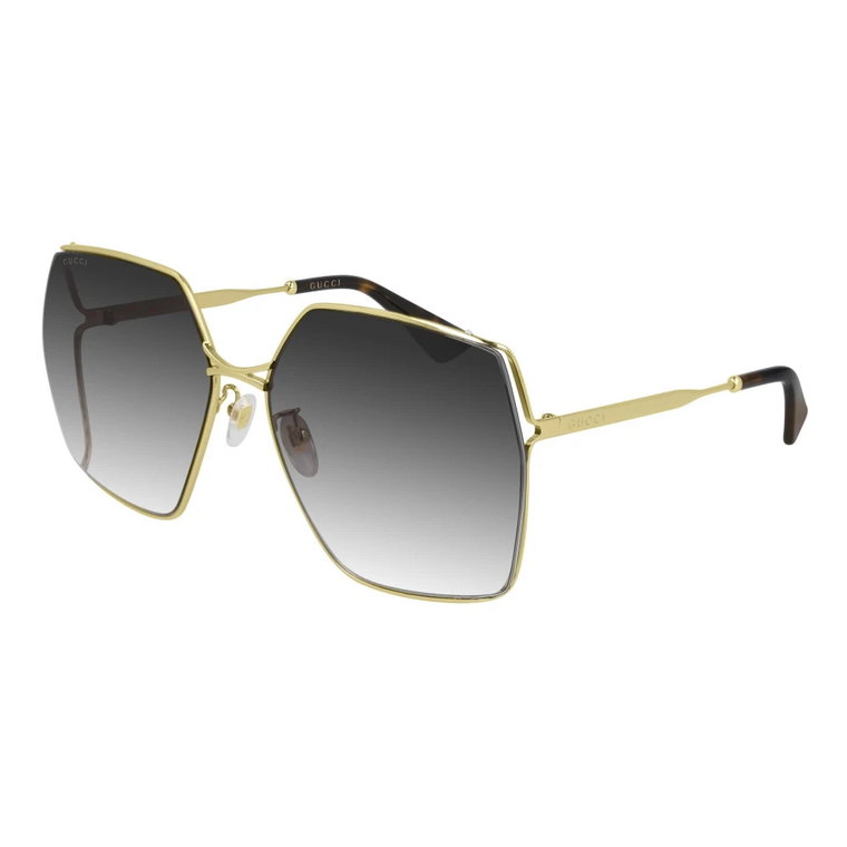 Eleganckie okulary przeciwsłoneczne z ramką w kolorze złota i szarymi soczewkami gradientowymi Gucci