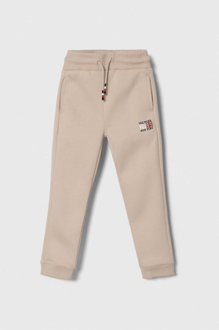 Tommy Hilfiger spodnie dresowe dziecięce kolor beżowy gładkie