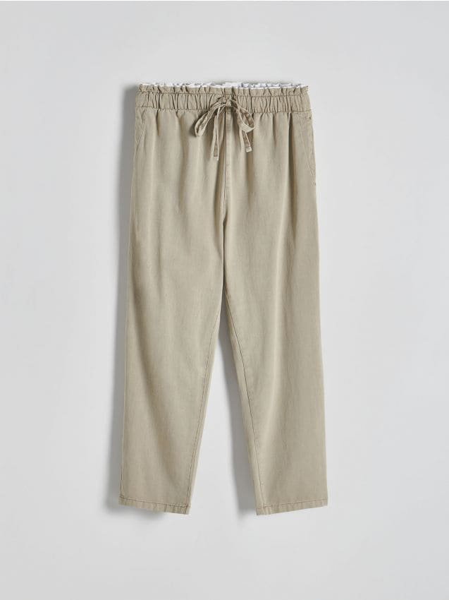 Reserved - Bawełniane spodnie jogger - jasnozielony