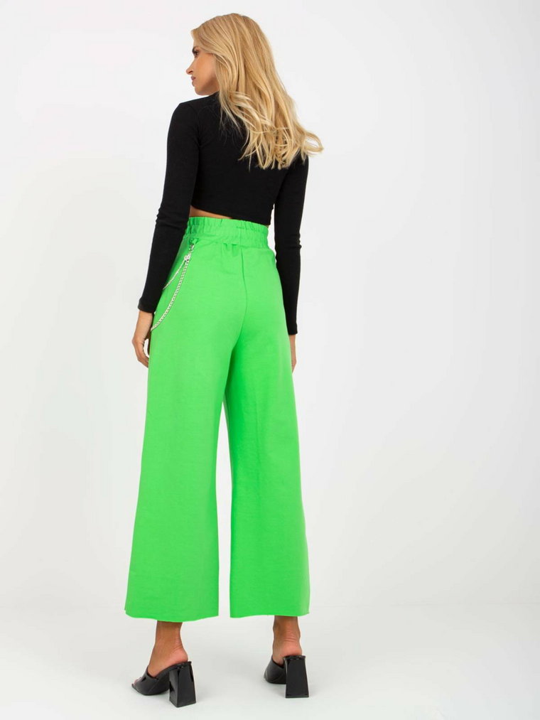 Spodnie dresowe jasny zielony casual nogawka szeroka print (nadruk) dziury