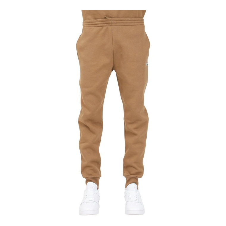 Spodnie dresowe męskie w kolorze Camel, Slim Fit, ściągacze w kostkach Lacoste