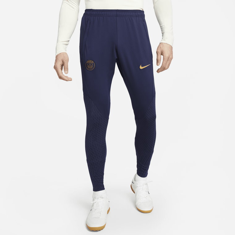 Męskie dzianinowe spodnie piłkarskie Paris Saint-Germain Strike Nike Dri-FIT - Niebieski