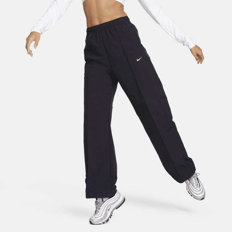 Damskie spodnie ze średnim stanem i luźnymi nogawkami Nike Sportswear Everything Wovens - Fiolet
