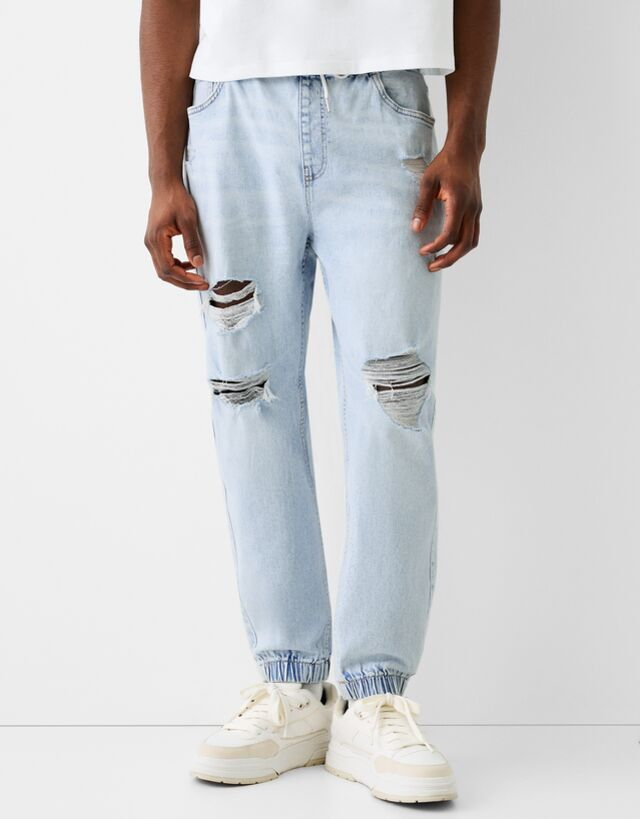 Bershka Jeansy Jogger Z Przetarciami Mężczyzna S Jasnoniebieski