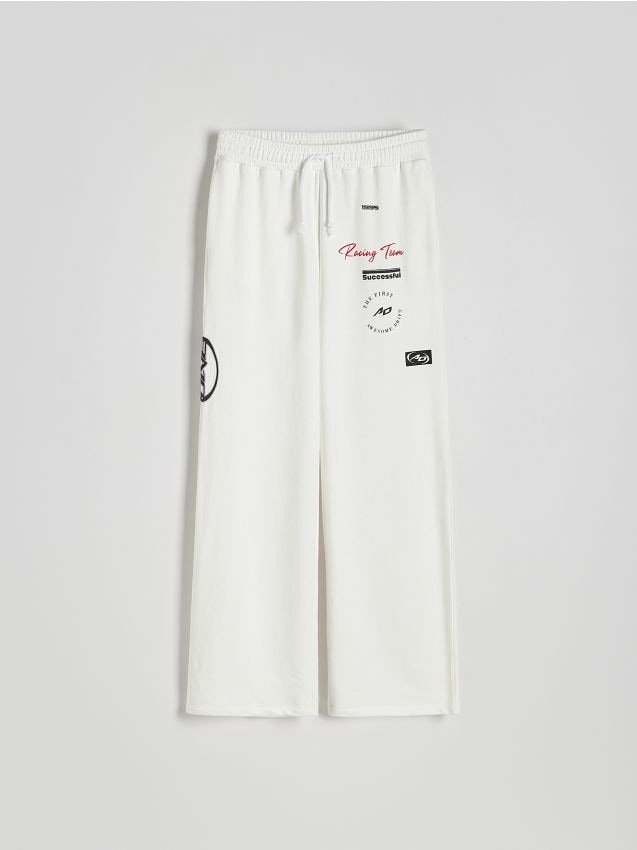Reserved - Spodnie dresowe z nadrukiem - biały