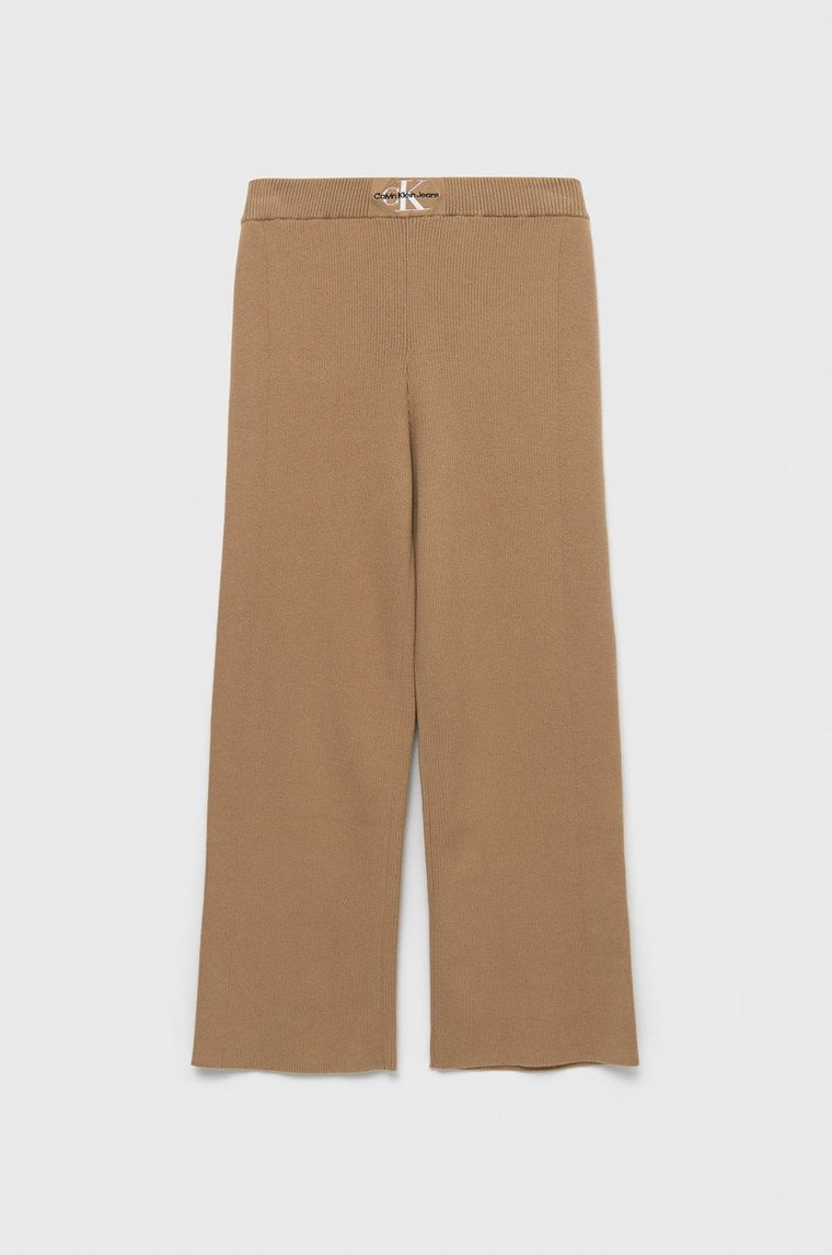 Calvin Klein Jeans spodnie dziecięce kolor beżowy gładkie