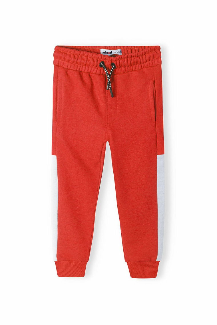 Czerwone spodnie dresowe dla chłopca z paskami