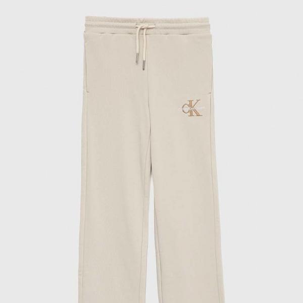 Calvin Klein Jeans spodnie dresowe bawełniane dziecięce kolor beżowy z aplikacją