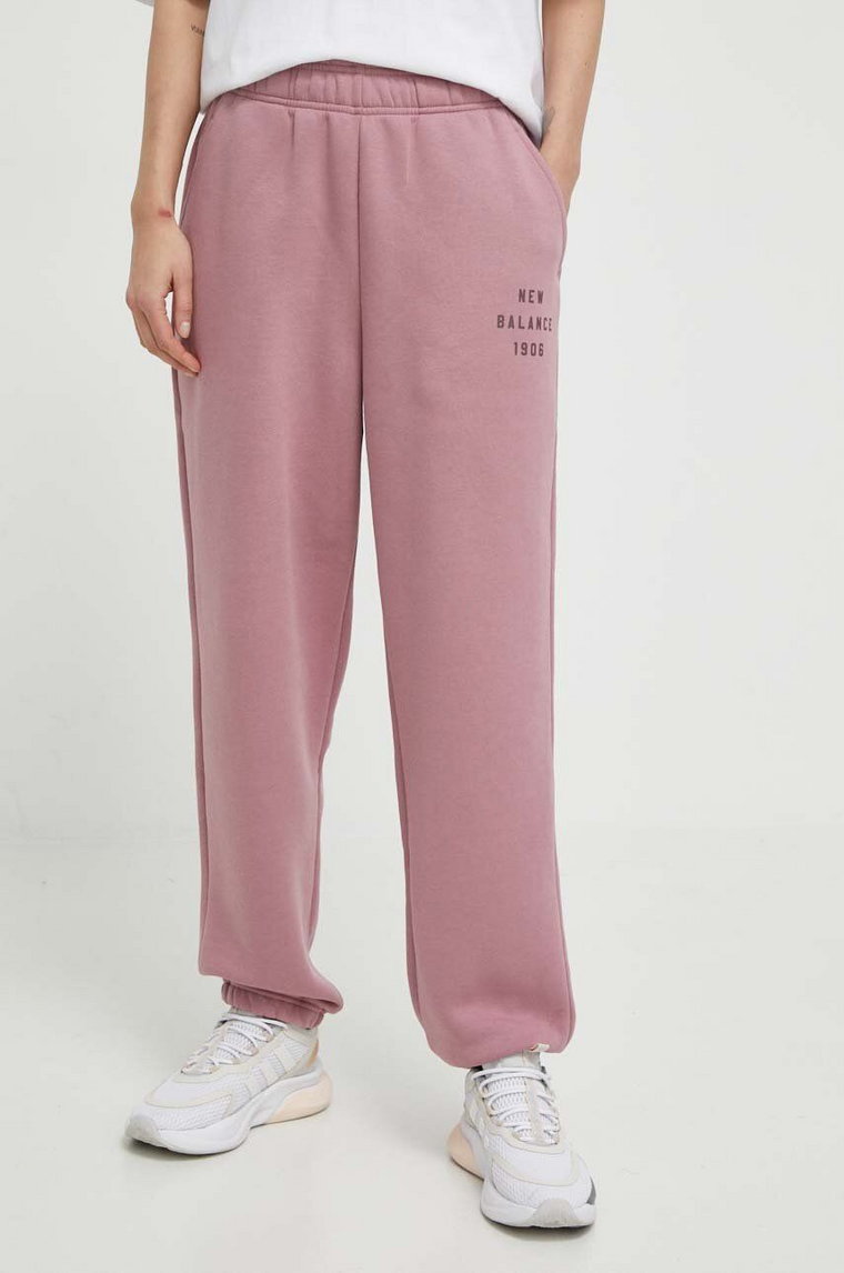 New Balance spodnie dresowe kolor różowy gładkie WP41508RSE
