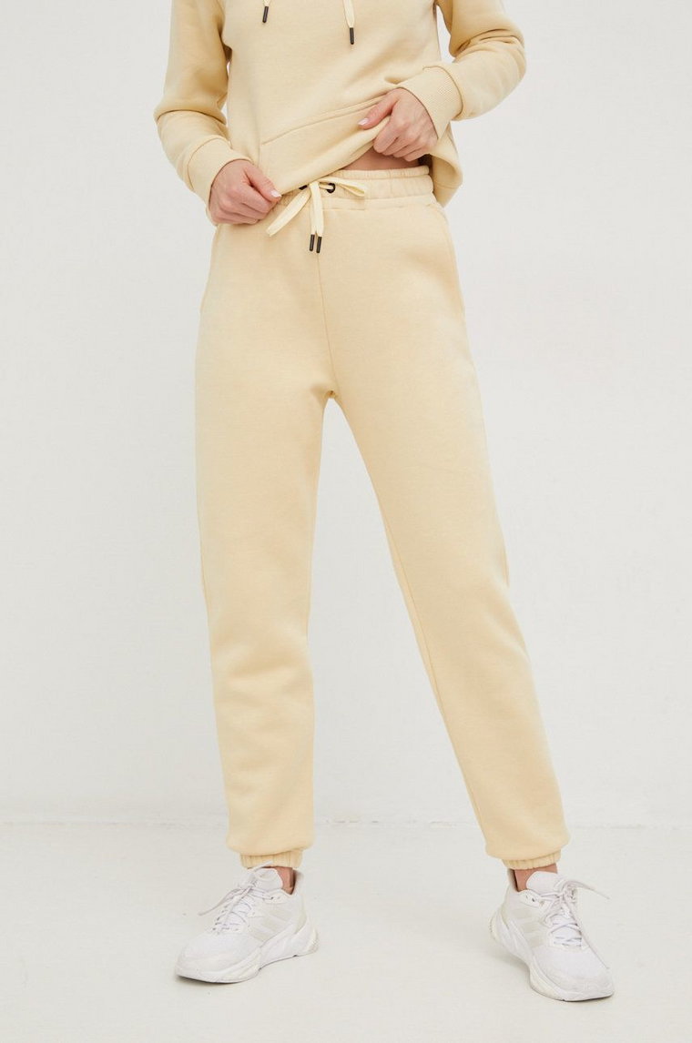 Peak Performance spodnie dresowe damskie kolor beżowy gładkie