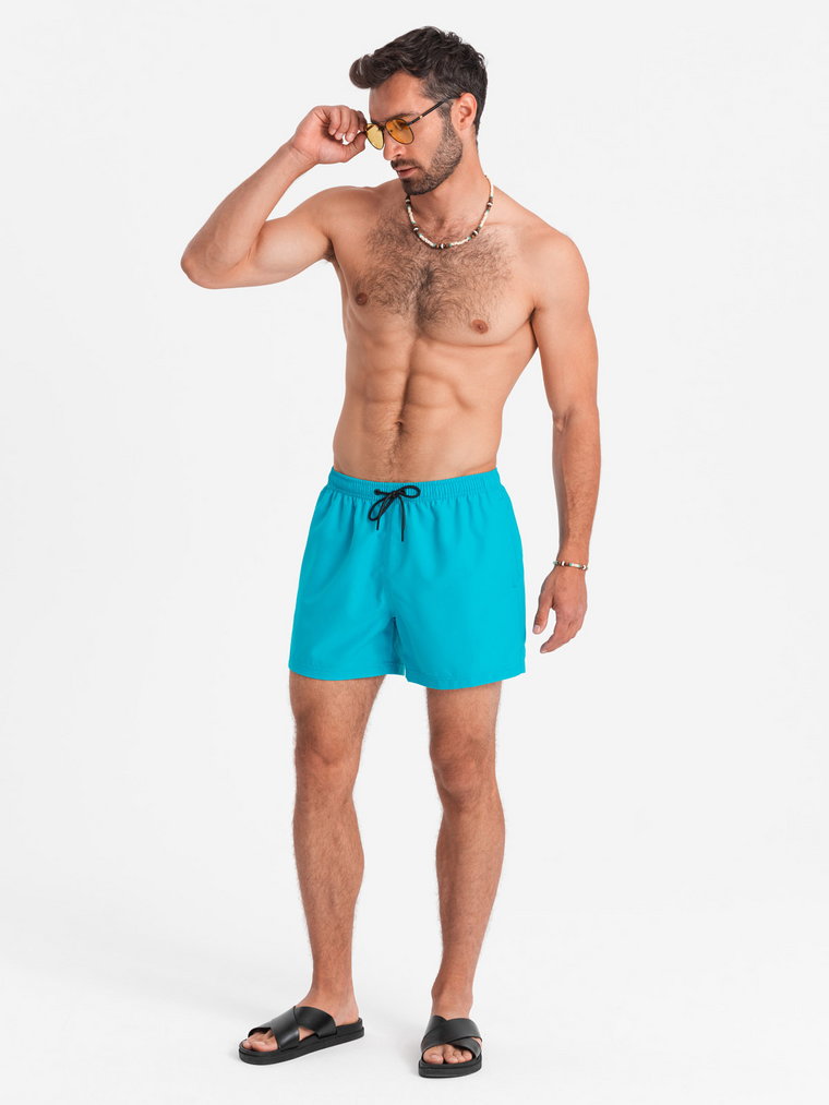 Neonowe szorty męskie kąpielowe z efektem magic print  turkusowe V2 OM-SRBS-0147