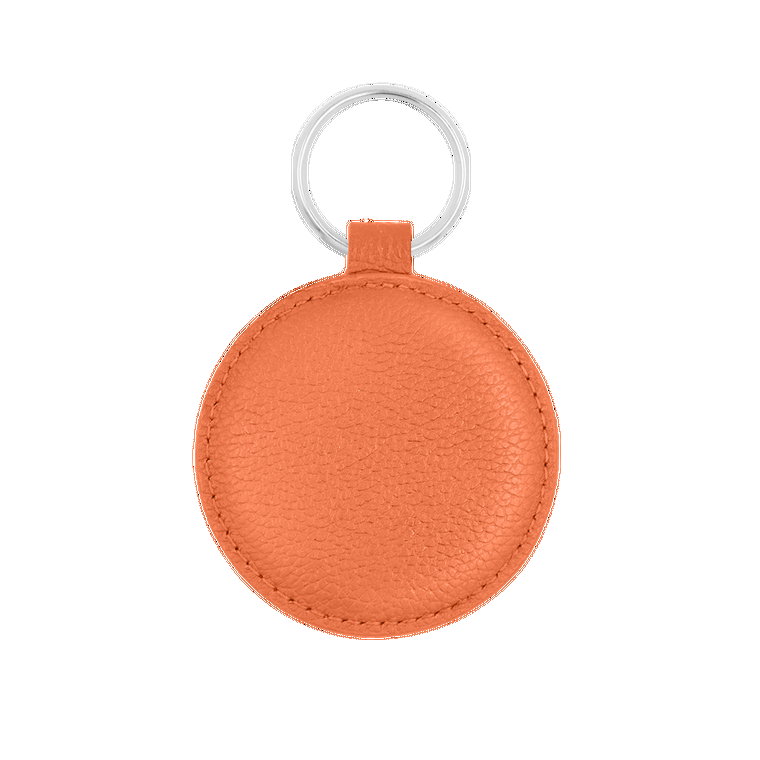 Brelok medalik pomarańczowy z okuciem w srebrnym kolorze