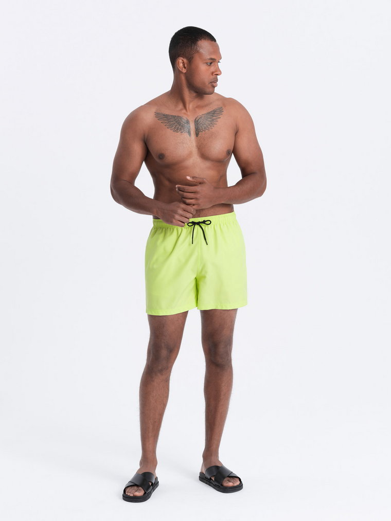 Neonowe męskie szorty kąpielowe z efektem magic print  limonkowe V1 OM-SRBS-0147