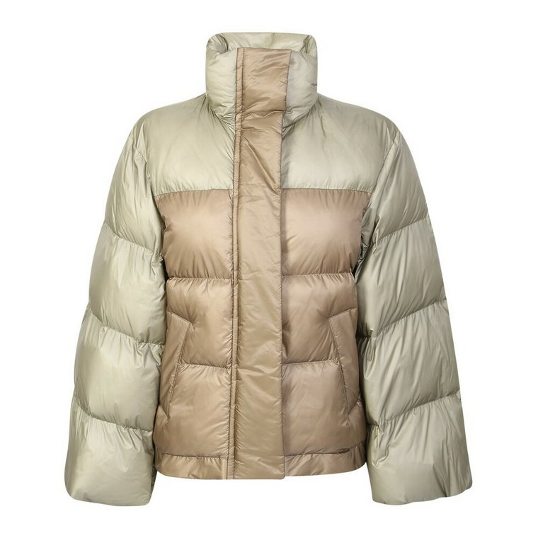 Down jacket with wide sleeve detail by Sacai. The brand has been described as influential in breaking down the dichotomy between casual and formal wear. Sacai