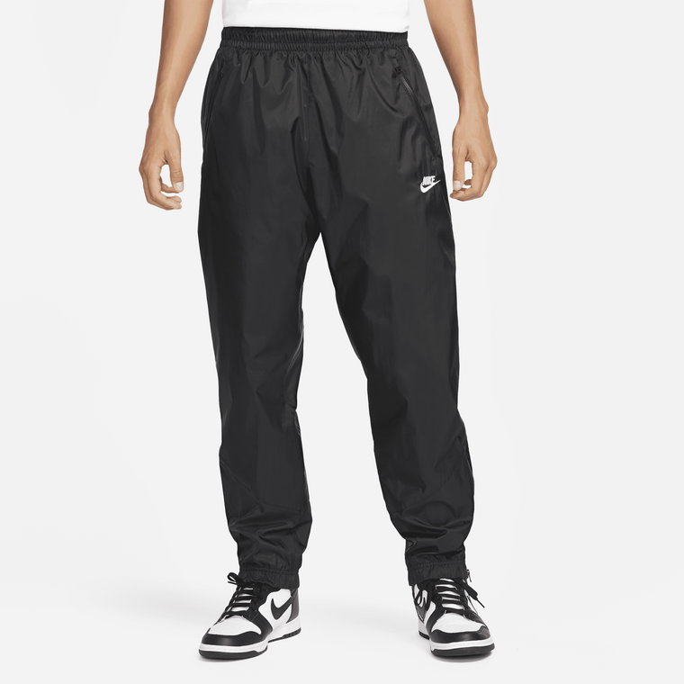 Męskie spodnie z tkaniny z podszewką Nike Windrunner - Szary