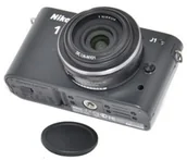 Dekielki do obiektywów - JJC LC-N101 osłona na obiektyw Aparat cyfrowy Czarny - miniaturka - grafika 1
