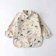 Śliniaki i fartuszki - Śliniak w dinozaury z kieszonką fartuszek r. S - miniaturka - grafika 1