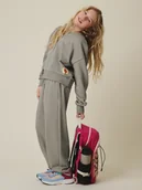 Spodnie i spodenki dla dziewczynek - 4F Spodnie dresowe z szerokimi nogawkami dziewczęce - beżowe 158/164 (12-14 lat) - miniaturka - grafika 1