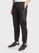 Spodnie sportowe męskie - Tommy Hilfiger Spodnie dresowe New York MW0MW29302 Czarny Regular Fit - miniaturka - grafika 1