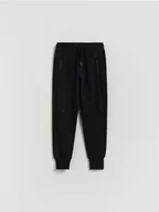 Spodnie i spodenki dla chłopców - Reserved - Bawełniane spodnie jogger - czarny - miniaturka - grafika 1