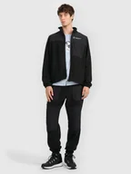 Spodnie sportowe męskie - 4F Spodnie polarowe joggery męskie - czarne XXL - miniaturka - grafika 1