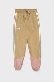 Spodnie damskie - Adidas Originals Originals spodnie dresowe dziecięce kolor beżowy z aplikacją - grafika 1