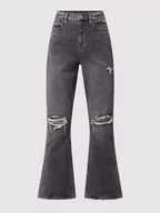 Spodnie damskie - Jeansy o rozkloszowanym kroju z bawełny - miniaturka - grafika 1