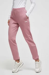 Spodnie damskie - Hummel spodnie dresowe bawełniane kolor różowy gładkie - grafika 1