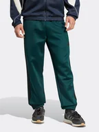 Spodnie sportowe męskie - adidas Spodnie dresowe w kolorze zielonym - miniaturka - grafika 1