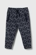 Spodnie i spodenki dla chłopców - Guess spodnie dresowe bawełniane dziecięce kolor granatowy wzorzyste - miniaturka - grafika 1