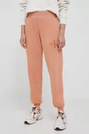 Spodnie damskie - Calvin Klein Jeans spodnie dresowe bawełniane kolor pomarańczowy gładkie - miniaturka - grafika 1