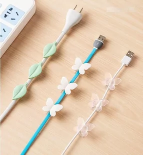 Ozdobny uchwyt na kable w kształcie motylka (9szt.) - biały - Akcesoria fotograficzne - miniaturka - grafika 1